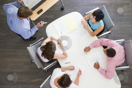 To use this stock image in your creative project, please select the size you need over to the right and click the "Add to Cart" button.
Your downloaded image will come with the Cutcaster watermark removed so don’t worry about the watermark you see on this page. Four businesspeople at boardroom table watching presentation stock photo, by Monkey Business Images