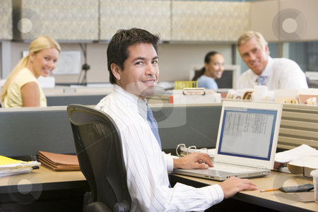To use this stock image in your creative project, please select the size you need over to the right and click the "Add to Cart" button.
Your downloaded image will come with the Cutcaster watermark removed so don’t worry about the watermark you see on this page. Businessman in cubicle with laptop smiling stock photo, by Monkey Business Images