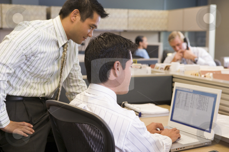 To use this stock image in your creative project, please select the size you need over to the right and click the "Add to Cart" button.
Your downloaded image will come with the Cutcaster watermark removed so don’t worry about the watermark you see on this page. Two businessmen in cubicle looking at laptop stock photo, by Monkey Business Images