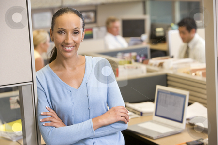 To use this stock image in your creative project, please select the size you need over to the right and click the "Add to Cart" button.
Your downloaded image will come with the Cutcaster watermark removed so don’t worry about the watermark you see on this page. Businesswoman standing in cubicle smiling stock photo, by Monkey Business Images