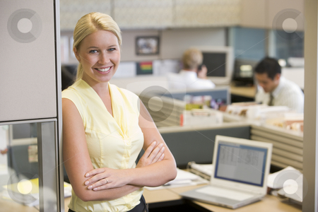 To use this stock image in your creative project, please select the size you need over to the right and click the "Add to Cart" button.
Your downloaded image will come with the Cutcaster watermark removed so don’t worry about the watermark you see on this page. Businesswoman standing in cubicle smiling stock photo, by Monkey Business Images