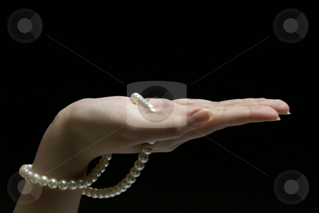 To use this stock image in your creative project, please select the size you need over to the right and click the "Add to Cart" button.
Your downloaded image will come with the Cutcaster watermark removed so don’t worry about the watermark you see on this page. Female hand with pearls stock photo, Female hand with pearls on black background by Wong Chee Yen
