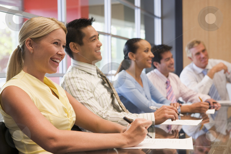 To use this stock image in your creative project, please select the size you need over to the right and click the "Add to Cart" button.
Your downloaded image will come with the Cutcaster watermark removed so don’t worry about the watermark you see on this page. Five businesspeople at boardroom table smiling stock photo, by Monkey Business Images