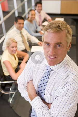 To use this stock image in your creative project, please select the size you need over to the right and click the "Add to Cart" button.
Your downloaded image will come with the Cutcaster watermark removed so don’t worry about the watermark you see on this page. Businessman with four businesspeople at boardroom table in backg stock photo, by Monkey Business Images