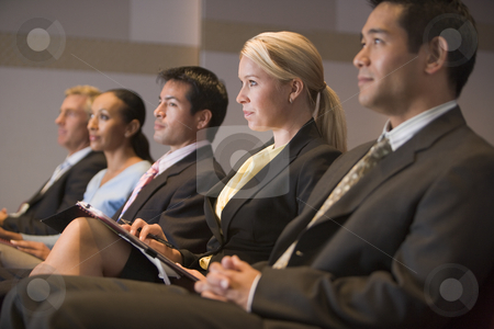 To use this stock image in your creative project, please select the size you need over to the right and click the "Add to Cart" button.
Your downloaded image will come with the Cutcaster watermark removed so don’t worry about the watermark you see on this page. Five businesspeople sitting in presentation room with clipboards stock photo, by Monkey Business Images