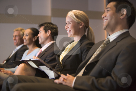 To use this stock image in your creative project, please select the size you need over to the right and click the "Add to Cart" button.
Your downloaded image will come with the Cutcaster watermark removed so don’t worry about the watermark you see on this page. Five businesspeople smiling in presentation room with clipboards stock photo, by Monkey Business Images