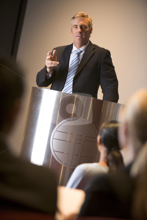 To use this stock image in your creative project, please select the size you need over to the right and click the "Add to Cart" button.
Your downloaded image will come with the Cutcaster watermark removed so don’t worry about the watermark you see on this page. Businessman giving presentation at podium stock photo, by Monkey Business Images