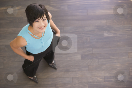 To use this stock image in your creative project, please select the size you need over to the right and click the "Add to Cart" button.
Your downloaded image will come with the Cutcaster watermark removed so don’t worry about the watermark you see on this page. Businesswoman standing indoors smiling stock photo, by Monkey Business Images