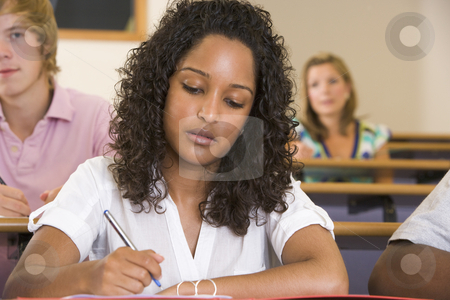 To use this stock image in your creative project, please select the size you need over to the right and click the "Add to Cart" button.
Your downloaded image will come with the Cutcaster watermark removed so don’t worry about the watermark you see on this page. Female college student taking notes in a university lecture stock photo, by Monkey Business Images