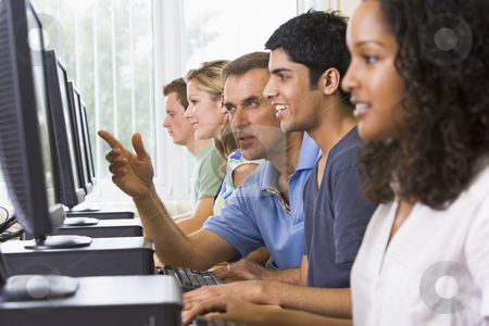To use this stock image in your creative project, please select the size you need over to the right and click the "Add to Cart" button.
Your downloaded image will come with the Cutcaster watermark removed so don’t worry about the watermark you see on this page. Teacher assisting college student in a computer lab stock photo, by Monkey Business Images