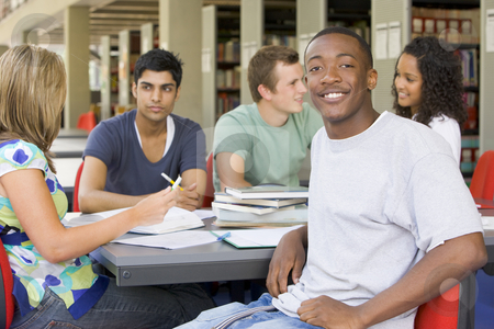 To use this stock image in your creative project, please select the size you need over to the right and click the "Add to Cart" button.
Your downloaded image will come with the Cutcaster watermark removed so don’t worry about the watermark you see on this page. College students studying together in a library stock photo, by Monkey Business Images
