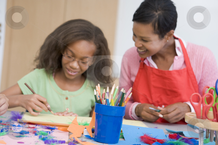 To use this stock image in your creative project, please select the size you need over to the right and click the "Add to Cart" button.
Your downloaded image will come with the Cutcaster watermark removed so don’t worry about the watermark you see on this page. Elementary school art class stock photo, Elementary school art class with teacher by Monkey Business Images