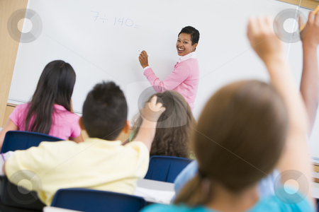 To use this stock image in your creative project, please select the size you need over to the right and click the "Add to Cart" button.
Your downloaded image will come with the Cutcaster watermark removed so don’t worry about the watermark you see on this page. Elementary school maths class stock photo, Teacher holding elementary school maths class by Monkey Business Images