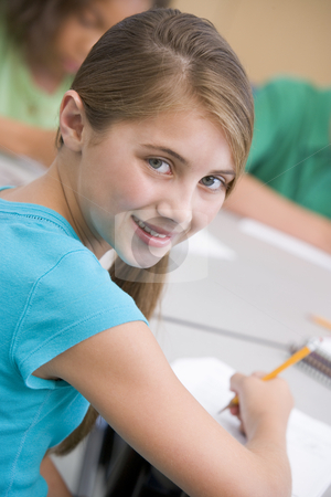 To use this stock image in your creative project, please select the size you need over to the right and click the "Add to Cart" button.
Your downloaded image will come with the Cutcaster watermark removed so don’t worry about the watermark you see on this page. Female elementary school pupil stock photo, Female elementary school pupil writing at desk by Monkey Business Images
