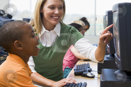 To use this stock image in your creative project, please select the size you need over to the right and click the "Add to Cart" button.
Your downloaded image will come with the Cutcaster watermark removed so don’t worry about the watermark you see on this page. Teacher helping kindergarten children learn how to use computers stock photo, by Monkey Business Images
