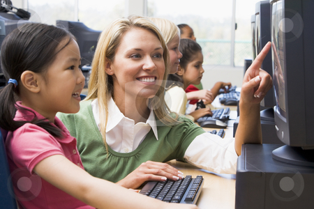 To use this stock image in your creative project, please select the size you need over to the right and click the "Add to Cart" button.
Your downloaded image will come with the Cutcaster watermark removed so don’t worry about the watermark you see on this page. Teacher helping kindergarten children learn how to use computers stock photo, by Monkey Business Images