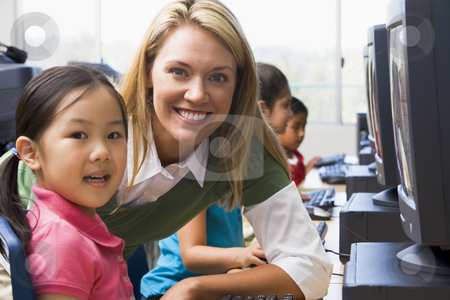 To use this stock image in your creative project, please select the size you need over to the right and click the "Add to Cart" button.
Your downloaded image will come with the Cutcaster watermark removed so don’t worry about the watermark you see on this page. Teacher helping kindergarten children learn how to use computers stock photo, by Monkey Business Images