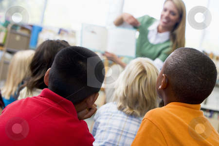 To use this stock image in your creative project, please select the size you need over to the right and click the "Add to Cart" button.
Your downloaded image will come with the Cutcaster watermark removed so don’t worry about the watermark you see on this page. Kindergarten teacher reading to children in library stock photo, by Monkey Business Images