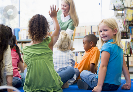 To use this stock image in your creative project, please select the size you need over to the right and click the "Add to Cart" button.
Your downloaded image will come with the Cutcaster watermark removed so don’t worry about the watermark you see on this page. Kindergarten teacher reading to children in library, girl lookin stock photo, by Monkey Business Images