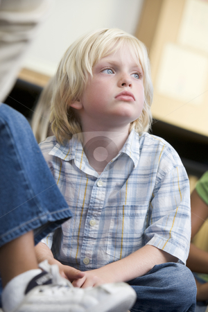 To use this stock image in your creative project, please select the size you need over to the right and click the "Add to Cart" button.
Your downloaded image will come with the Cutcaster watermark removed so don’t worry about the watermark you see on this page. Boy daydreaming at kindergarten stock photo, by Monkey Business Images
