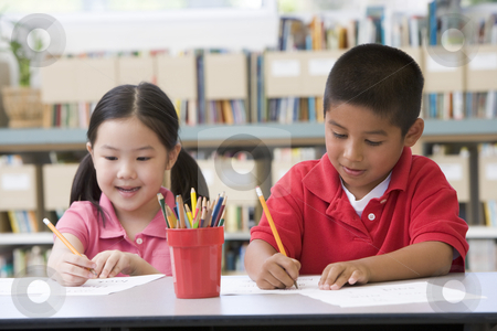 To use this stock image in your creative project, please select the size you need over to the right and click the "Add to Cart" button.
Your downloaded image will come with the Cutcaster watermark removed so don’t worry about the watermark you see on this page. Kindergarten children sitting at desk and writing in classroom stock photo, by Monkey Business Images