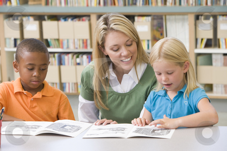 To use this stock image in your creative project, please select the size you need over to the right and click the "Add to Cart" button.
Your downloaded image will come with the Cutcaster watermark removed so don’t worry about the watermark you see on this page. Kindergarten teacher helping students with reading skills stock photo, by Monkey Business Images