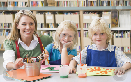 To use this stock image in your creative project, please select the size you need over to the right and click the "Add to Cart" button.
Your downloaded image will come with the Cutcaster watermark removed so don’t worry about the watermark you see on this page. Kindergarten teacher sitting with students in art class stock photo, by Monkey Business Images