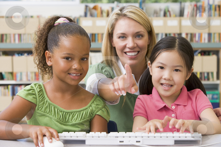 To use this stock image in your creative project, please select the size you need over to the right and click the "Add to Cart" button.
Your downloaded image will come with the Cutcaster watermark removed so don’t worry about the watermark you see on this page. Kindergarten teacher sitting with children at computer stock photo, by Monkey Business Images
