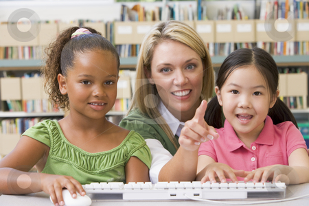 To use this stock image in your creative project, please select the size you need over to the right and click the "Add to Cart" button.
Your downloaded image will come with the Cutcaster watermark removed so don’t worry about the watermark you see on this page. Kindergarten teacher sitting with children at computer stock photo, by Monkey Business Images