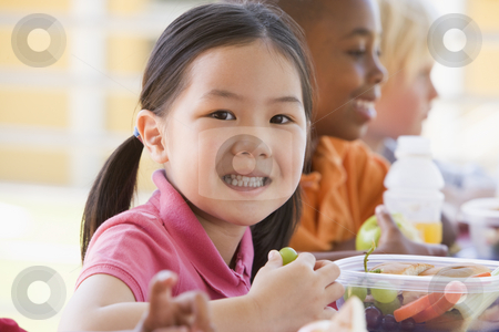 To use this stock image in your creative project, please select the size you need over to the right and click the "Add to Cart" button.
Your downloaded image will come with the Cutcaster watermark removed so don’t worry about the watermark you see on this page. Kindergarten children eating lunch stock photo, by Monkey Business Images