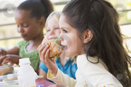 To use this stock image in your creative project, please select the size you need over to the right and click the "Add to Cart" button.
Your downloaded image will come with the Cutcaster watermark removed so don’t worry about the watermark you see on this page. Kindergarten children eating lunch stock photo, by Monkey Business Images