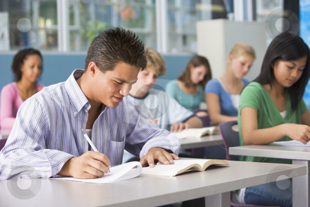 To use this stock image in your creative project, please select the size you need over to the right and click the "Add to Cart" button.
Your downloaded image will come with the Cutcaster watermark removed so don’t worry about the watermark you see on this page. Schoolboy in high school class stock photo, by Monkey Business Images