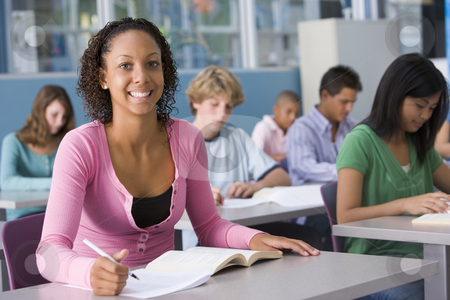To use this stock image in your creative project, please select the size you need over to the right and click the "Add to Cart" button.
Your downloaded image will come with the Cutcaster watermark removed so don’t worry about the watermark you see on this page. Schoolgirl in high school class stock photo, by Monkey Business Images