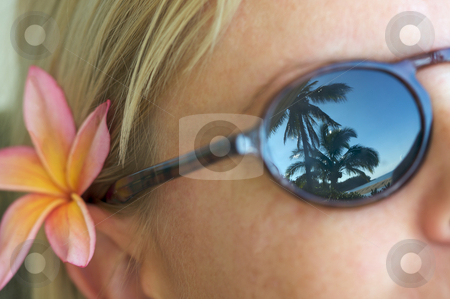 To use this stock image in your creative project, please select the size you need over to the right and click the "Add to Cart" button.
Your downloaded image will come with the Cutcaster watermark removed so don’t worry about the watermark you see on this page. Tropical Relaxation stock photo, Woman Relaxing while Sunglasses Reflect Palm Trees and Shorline. by Andy Dean