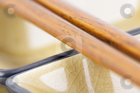 To use this stock image in your creative project, please select the size you need over to the right and click the "Add to Cart" button.
Your downloaded image will come with the Cutcaster watermark removed so don’t worry about the watermark you see on this page. Abstract Chopsticks and Bowls stock photo, Abstract Chopsticks and Bowls with Narrow Depth of Field. by Andy Dean