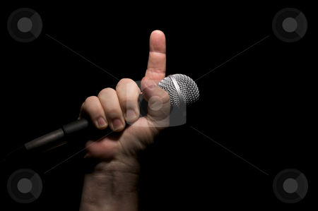 To use this stock image in your creative project, please select the size you need over to the right and click the "Add to Cart" button.
Your downloaded image will come with the Cutcaster watermark removed so don’t worry about the watermark you see on this page. Microphone in Fist stock photo, Microphone clinched firmly in male fist with index finger pointing up. by Andy Dean