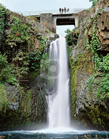 To use this stock image in your creative project, please select the size you need over to the right and click the "Add to Cart" button.
Your downloaded image will come with the Cutcaster watermark removed so don’t worry about the watermark you see on this page. Bridge over waterfall stock photo, Famous waterfall in Comores islands by Seregey Korotkov