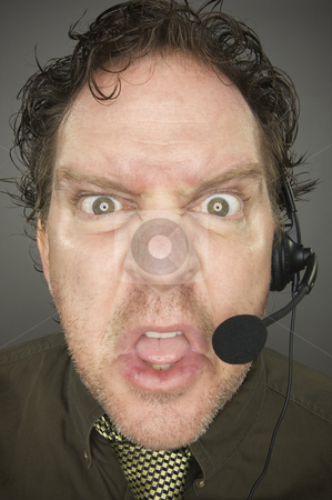To use this stock image in your creative project, please select the size you need over to the right and click the "Add to Cart" button.
Your downloaded image will come with the Cutcaster watermark removed so don’t worry about the watermark you see on this page. Irate Businessman stock photo, Irate Businessman Wearing a Phone Headset Against a Grey Background. by Andy Dean