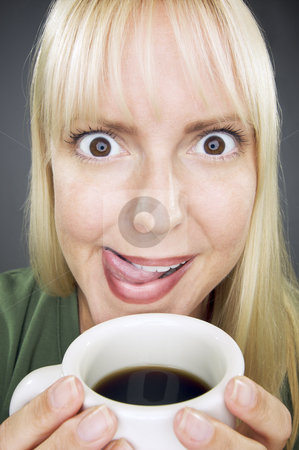 To use this stock image in your creative project, please select the size you need over to the right and click the "Add to Cart" button.
Your downloaded image will come with the Cutcaster watermark removed so don’t worry about the watermark you see on this page. Beautiful Woman Enjoys Coffee stock photo, Beautiful Woman Enjoys Her Coffee Against a Grey Background. by Andy Dean