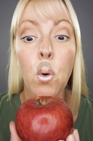 To use this stock image in your creative project, please select the size you need over to the right and click the "Add to Cart" button.
Your downloaded image will come with the Cutcaster watermark removed so don’t worry about the watermark you see on this page. Beautiful Woman With Apple stock photo, Beautiful Woman With Apple Against A Grey Background by Andy Dean
