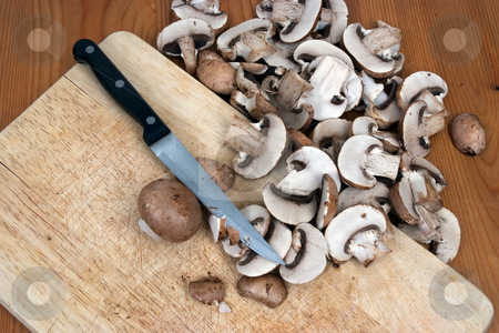 To use this stock image in your creative project, please select the size you need over to the right and click the "Add to Cart" button.
Your downloaded image will come with the Cutcaster watermark removed so don’t worry about the watermark you see on this page. Slicing mushrooms stock photo, Organic mushrooms being sliced on a chopping board by Paul Phillips