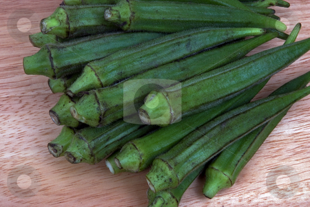 To use this stock image in your creative project, please select the size you need over to the right and click the "Add to Cart" button.
Your downloaded image will come with the Cutcaster watermark removed so don’t worry about the watermark you see on this page. Okra stock photo, A group of Okra on a cutting board by Paul Phillips