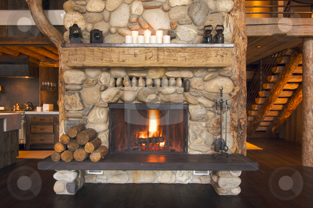 To use this stock image in your creative project, please select the size you need over to the right and click the "Add to Cart" button.
Your downloaded image will come with the Cutcaster watermark removed so don’t worry about the watermark you see on this page. Rustic Fireplace stock photo, Rustic Fireplace in Log Cabin by Andy Dean