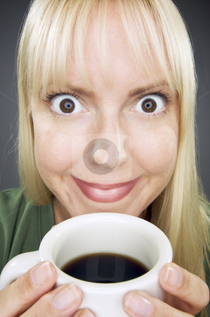 To use this stock image in your creative project, please select the size you need over to the right and click the "Add to Cart" button.
Your downloaded image will come with the Cutcaster watermark removed so don’t worry about the watermark you see on this page. Beautiful Woman Enjoys Coffee stock photo, Beautiful Woman Enjoys Her Coffee Against a Grey Background. by Andy Dean