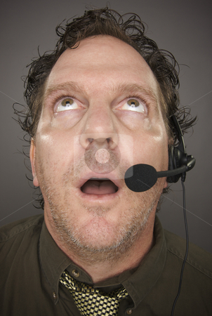 To use this stock image in your creative project, please select the size you need over to the right and click the "Add to Cart" button.
Your downloaded image will come with the Cutcaster watermark removed so don’t worry about the watermark you see on this page. Bewildered Businessman stock photo, Bewildered Businessman Wearing Phone Headset Against a Grey Background. by Andy Dean