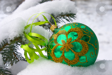 To use this stock image in your creative project, please select the size you need over to the right and click the "Add to Cart" button.
Your downloaded image will come with the Cutcaster watermark removed so don’t worry about the watermark you see on this page. Christmas time. stock photo, A green christmas bauble sitting in a bed of snow. by Yury Ponomarev