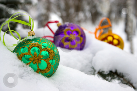 To use this stock image in your creative project, please select the size you need over to the right and click the "Add to Cart" button.
Your downloaded image will come with the Cutcaster watermark removed so don’t worry about the watermark you see on this page. Christmas-tree. stock photo, Three color christmas baubles sitting in a bed of snow. by Yury Ponomarev