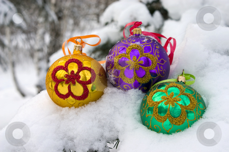 To use this stock image in your creative project, please select the size you need over to the right and click the "Add to Cart" button.
Your downloaded image will come with the Cutcaster watermark removed so don’t worry about the watermark you see on this page. Christmas time. stock photo, Three color christmas baubles sitting in a bed of snow. by Yury Ponomarev