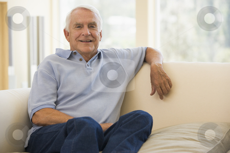 To use this stock image in your creative project, please select the size you need over to the right and click the "Add to Cart" button.
Your downloaded image will come with the Cutcaster watermark removed so don’t worry about the watermark you see on this page. Man in living room smiling stock photo, by Monkey Business Images