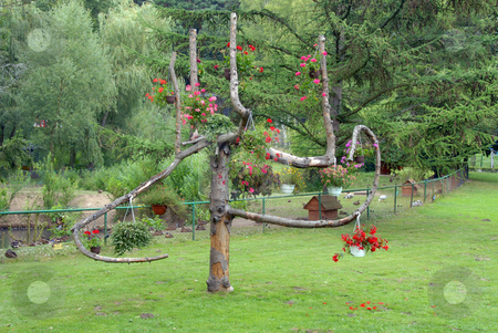 To use this stock image in your creative project, please select the size you need over to the right and click the "Add to Cart" button.
Your downloaded image will come with the Cutcaster watermark removed so don’t worry about the watermark you see on this page. Flowers on tree stock photo, Some beautiful flowers on a old tree by Joanna Szycik